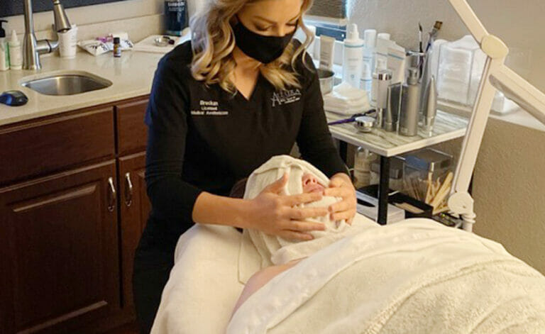 Allura patient receiving facial treatment